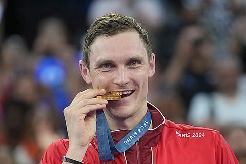 Badminton Men's singles: Denmark's Viktor Axelsen celebrates after winning the gold medal